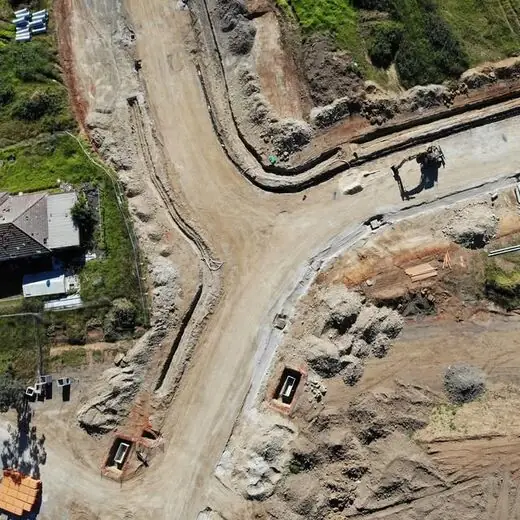Top down view of a road junction with service pits