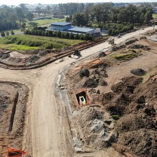 Low aerial view of a service pit beside a new road