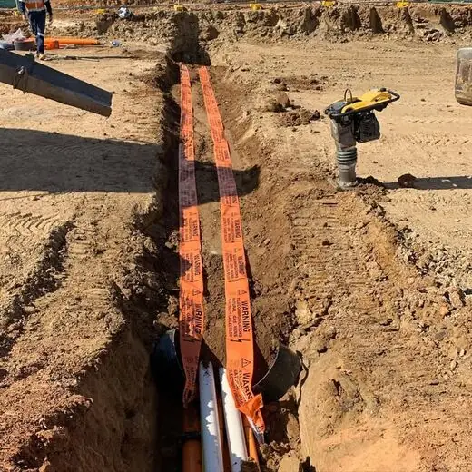 Warning tape laid and trench backfilled